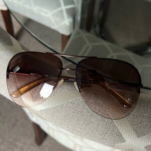 Prada sunglasses. One size fits all. Perfect condition, no scratches. Case.